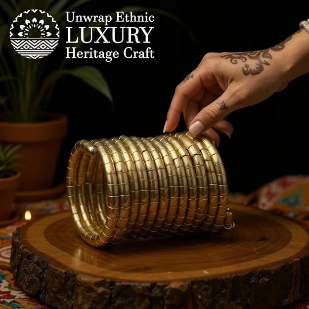 Traditional brass bangles with an antique finish, arranged on a wooden surface, hand held, featuring an openable kada style.