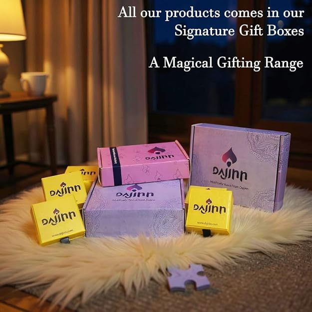 Colorful gift boxes in shades of purple and yellow, styled on a plush white surface, showcasing the Dajinn brand.