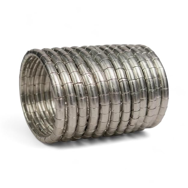 A set of traditional brass bangles with a sleek coil design in a silver finish. Suitable for various wrist sizes.