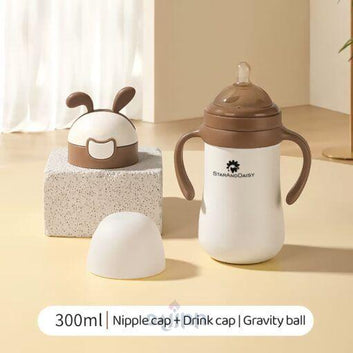 DaJinn 2-in-1 First Feed Baby Feeding Bottle and Sippy Cup with Gravity Ball and Handles – 300ML